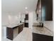 Well-equipped kitchen featuring an island, stainless steel appliances and granite countertops at 856 Teton St, Haines City, FL 33844