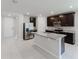 Contemporary kitchen featuring granite countertops, stainless steel appliances, and island at 856 Teton St, Haines City, FL 33844