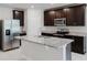 Stylish kitchen with granite countertops, island and stainless steel appliances at 856 Teton St, Haines City, FL 33844
