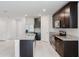 Spacious kitchen boasts stainless steel appliances, granite countertops, and ample cabinet space at 856 Teton St, Haines City, FL 33844