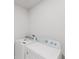 Bright laundry room with side by side washer and dryer at 856 Teton St, Haines City, FL 33844