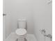 Toilet with silver fixtures and molding at 856 Teton St, Haines City, FL 33844