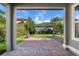 Covered back patio provides a place to enjoy the manicured backyard at 8692 Tavistock Lakes Blvd, Orlando, FL 32827