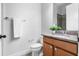 Bathroom with granite vanity, updated sink and faucet, toilet and towel rack at 8692 Tavistock Lakes Blvd, Orlando, FL 32827