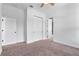 Bedroom featuring neutral paint, carpet, and closet space at 8692 Tavistock Lakes Blvd, Orlando, FL 32827
