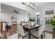 Bright and open dining room seamlessly connects to the kitchen and living area, perfect for entertaining at 8692 Tavistock Lakes Blvd, Orlando, FL 32827