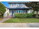 Charming two-story home with well-manicured lawn and attractive landscaping enhancing its curb appeal at 8692 Tavistock Lakes Blvd, Orlando, FL 32827