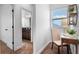 Hallway featuring a view of a bathroom with a double vanity at 8692 Tavistock Lakes Blvd, Orlando, FL 32827