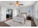 Inviting main bedroom with a decorative rug and private bathroom provides a relaxing space at 8692 Tavistock Lakes Blvd, Orlando, FL 32827