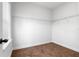 Walk-in closet with carpeted floor and white wire shelving along the walls at 8692 Tavistock Lakes Blvd, Orlando, FL 32827