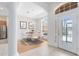Bright dining room with modern chandelier, white dining set, and lots of natural light at 9330 Shadow Pinar Ct, Orlando, FL 32825