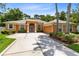 Charming single-story home featuring a well-manicured lawn and a spacious driveway at 9330 Shadow Pinar Ct, Orlando, FL 32825