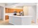 Well-equipped kitchen featuring white countertops, stainless steel appliances, and ample cabinetry at 9330 Shadow Pinar Ct, Orlando, FL 32825