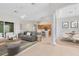 Open concept living room featuring a modern fireplace, couch, and lots of seating at 9330 Shadow Pinar Ct, Orlando, FL 32825