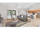 Open concept living room featuring a modern fireplace, couch, and lots of seating at 9330 Shadow Pinar Ct, Orlando, FL 32825