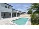 Backyard with a beautiful swimming pool and patio area, perfect for entertaining guests at 9917 Summerlake Groves St, Winter Garden, FL 34787