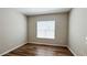 Cozy room featuring hardwood floors, neutral paint, and a window for natural light at 9917 Summerlake Groves St, Winter Garden, FL 34787