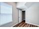 Bedroom with hardwood floors, a walk-in closet, and a window at 9917 Summerlake Groves St, Winter Garden, FL 34787
