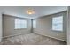 Bright bedroom with neutral walls, carpet, and multiple windows for natural light at 9917 Summerlake Groves St, Winter Garden, FL 34787