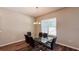 Dining room with hardwood floors, chandelier, and a modern glass dining table with six chairs at 9917 Summerlake Groves St, Winter Garden, FL 34787