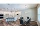 Spacious kitchen with a large island, seating, stainless steel appliances, and a dining area at 9917 Summerlake Groves St, Winter Garden, FL 34787