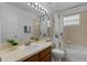 Clean bathroom featuring a vanity with sink and mirror, with a tub and shower at 10125 Sandy Marsh Ln, Orlando, FL 32832
