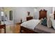 Spacious bedroom featuring gleaming hardwood floors, a closet and outdoor access at 10125 Sandy Marsh Ln, Orlando, FL 32832