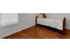 Cozy bedroom with hardwood flooring and natural light from the window at 10125 Sandy Marsh Ln, Orlando, FL 32832