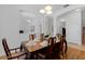 Formal dining room showcasing a wooden table, six chairs, and classic decor at 10125 Sandy Marsh Ln, Orlando, FL 32832