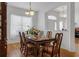 Cozy dining area perfect for meals, featuring hardwood floors, abundant natural light, and elegant decor at 10125 Sandy Marsh Ln, Orlando, FL 32832