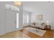 Inviting foyer showcasing tile floors, hardwood floors, and an abundance of natural light at 10125 Sandy Marsh Ln, Orlando, FL 32832
