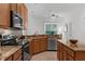 Kitchen with granite countertops, stainless steel appliances, and an eat-in area at 10125 Sandy Marsh Ln, Orlando, FL 32832