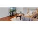 Cozy living room with hardwood floors, comfortable seating, and view of TV at 10125 Sandy Marsh Ln, Orlando, FL 32832