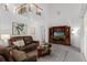 Bright living room boasting soaring ceilings, neutral colors, and tile floors, creating a spacious atmosphere at 10125 Sandy Marsh Ln, Orlando, FL 32832