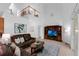 Bright living room featuring a vaulted ceiling, tile floors and a second story balcony at 10125 Sandy Marsh Ln, Orlando, FL 32832