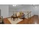Cozy loft area with comfortable seating, wooden floors, and a ceiling fan at 10125 Sandy Marsh Ln, Orlando, FL 32832