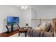 Second floor living area with TV and view of the neighborhood from windows at 10125 Sandy Marsh Ln, Orlando, FL 32832