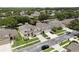 Beautiful two story home with a well maintained lawn and a paved driveway on a tree lined street at 10125 Sandy Marsh Ln, Orlando, FL 32832