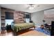 Bedroom with wood accent wall and an area for music rehearsal at 10169 Matchlock Dr, Orlando, FL 32821