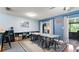Open-concept dining space featuring ample natural light and a large table for Gathering gatherings at 10169 Matchlock Dr, Orlando, FL 32821