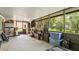 Enclosed patio with an assortment of tools and storage items at 10169 Matchlock Dr, Orlando, FL 32821