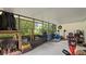 Enclosed patio with an assortment of tools and storage items at 10169 Matchlock Dr, Orlando, FL 32821
