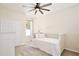 Bedroom featuring carpet floors, a ceiling fan and a window at 1034 Alvina Ln, Oviedo, FL 32765