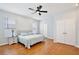 Serene bedroom featuring hardwood floors, natural light, and a ceiling fan at 1034 Alvina Ln, Oviedo, FL 32765