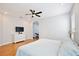 Bright bedroom with hardwood floors, ceiling fan, and plenty of natural light at 1034 Alvina Ln, Oviedo, FL 32765