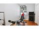 Bright exercise room featuring a home gym, window, and wood floors at 1034 Alvina Ln, Oviedo, FL 32765