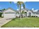 Well-maintained single-Gathering home features a manicured lawn and inviting curb appeal at 1034 Alvina Ln, Oviedo, FL 32765