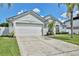 A spacious garage enhances the exterior view of this well-maintained home at 1034 Alvina Ln, Oviedo, FL 32765