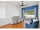 An open-plan living room leads to a pool view, featuring stylish seating and decor at 1034 Alvina Ln, Oviedo, FL 32765