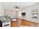 Comfortable living room featuring hardwood floors, ceiling fan, and modern decor at 1034 Alvina Ln, Oviedo, FL 32765